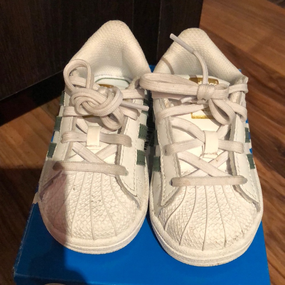 Green and white kid adidas